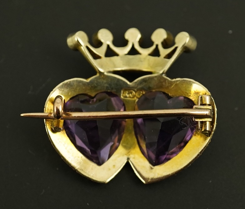 A late Victorian 9ct gold, two stone heart shaped amethyst and seed pearl cluster set coronet brooch